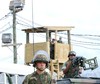 File - Guantanamo Bay, Cuba, Jan. 10, 2002 -- Marine security teams take up positions during a rehearsal for handling incoming detainees at Camp X-Ray, one of the holding facilities for Taliban and Al Qaida detainees.