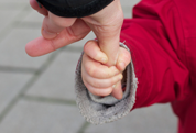 Child holding parent's finger