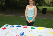 Girl at Perth Single Parents' rally with handprints