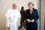 In this photo provided by the Vatican newspaper l'Osservatore Romano, Pope Francis meets with German Chancellor Angela Merkel during a private audience at the Vatican, Saturday, May 18, 2013.