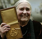 British author Doris Lessing (L) shows h