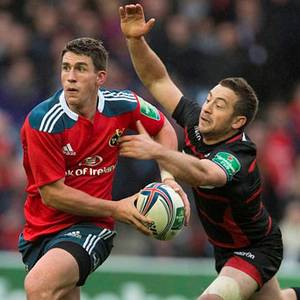 Munster's Ian Keatley evades a tackle from Edinburgh's Greig Laidlaw (right) during the Heineken Cup match at Murrayfield.