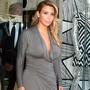 Kim Kardashian looks sleek in her grey wrap dress