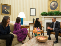 President Barack Obama, First Lady Michelle Obama, and their daughter Malia meet with Malala Yousafzai, the young Pakistani schoolgirl who was shot in the head by the Taliban a year ago, in the Oval Office, Oct. 11, 2013. 
(Photo by Pete Souza/The White House)