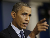 President Barack Obama talks about the continuing budget battle on Tuesday, Oct. 8, 2013, in the Brady Press Room of the White House in Washington. (Photo by Martinez Monsivais/AP)