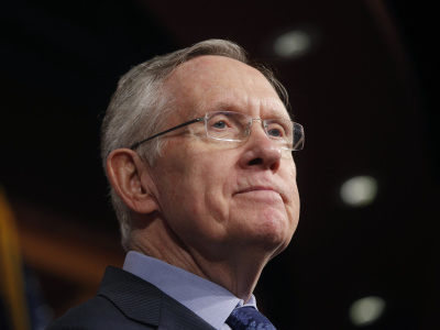 Senate Majority Leader Harry Reid of Nevada, listens to a reporter's question about their meeting with Senate Republicans regarding the government shutdown and debt ceiling on Capitol Hill in Washington on Saturday, Oct. 12, 2013. (Photo by Charles Dharapak/AP)