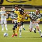 IF Elfsborg's Mohamed Bangura, center, fights for the ball with Glasgow Celtic's Charlie Mulgrew, left, and Scott Brown during the UEFA Champions League qualification soccer match between IF Elfsborg and Glasgow Celtic FC in Boras, Sweden