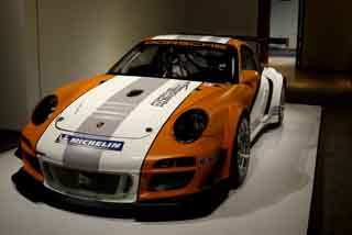 In this photo taken Wednesday, Oct. 9, 2013 a 2010 Porsche Type 911 GT3 R Hybrid Race Car Prototype is on display in the Porsche By Design exhibit at the North Carolina Museum of Art in Raleigh, N.C. (AP Photo/Gerry Broome)