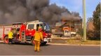 Firefighters from New South Wales Rural Fire Service (RFS) arrive to put out a fire at a property in Lithgow, New South Wales