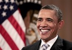 President Barack Obama smiles during his interview with The Associated Press, Friday, April 15, 2011, in Chicago.