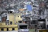 Policemen stand on the roof of a house during the inauguration of the Peacekeeping Unit Program (UPP) in Rocinha slum  in Rio de Janeiro.