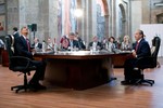 File - President Barack Obama, looks up at the ceiling of the Cabanas Cultural Center before a trilateral meeting with Canada's Prime Minister Stephen Harper and Mexico's President Felipe Calderon at the North American Leaders' Summit in Guadalajara, Mexico, on Aug. 10, 2009.