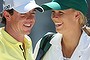 Rory McIlroy of Northern Ireland stands with his caddie Caroline Wozniacki