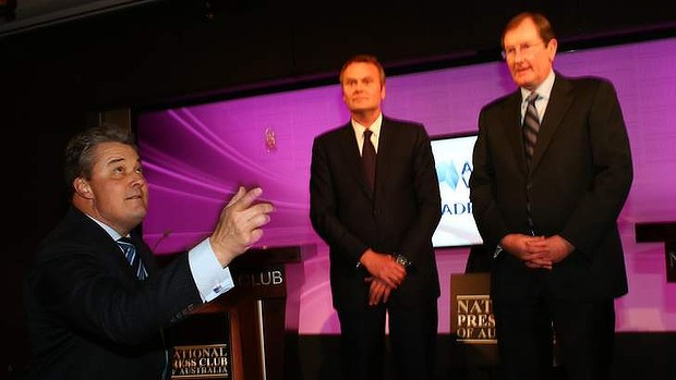 Maurice ReillyCEO of the National Press Club, tosses the coin for Labor campaign director George Wright and Coalition campaign director Brian Loughnane.