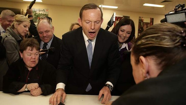 Opposition leader Tony Abbott meets with employees during his visit to a disability services business in Corio, Victoria, on Tuesday.