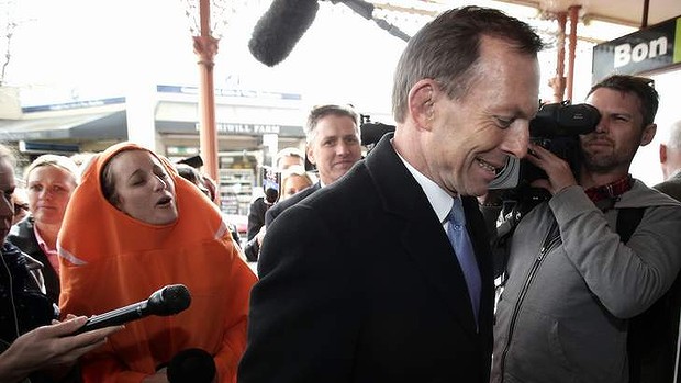 A protester heckles Opposition leader Tony Abbott during a streetwalk in Geelong, Victoria, on Tuesday.