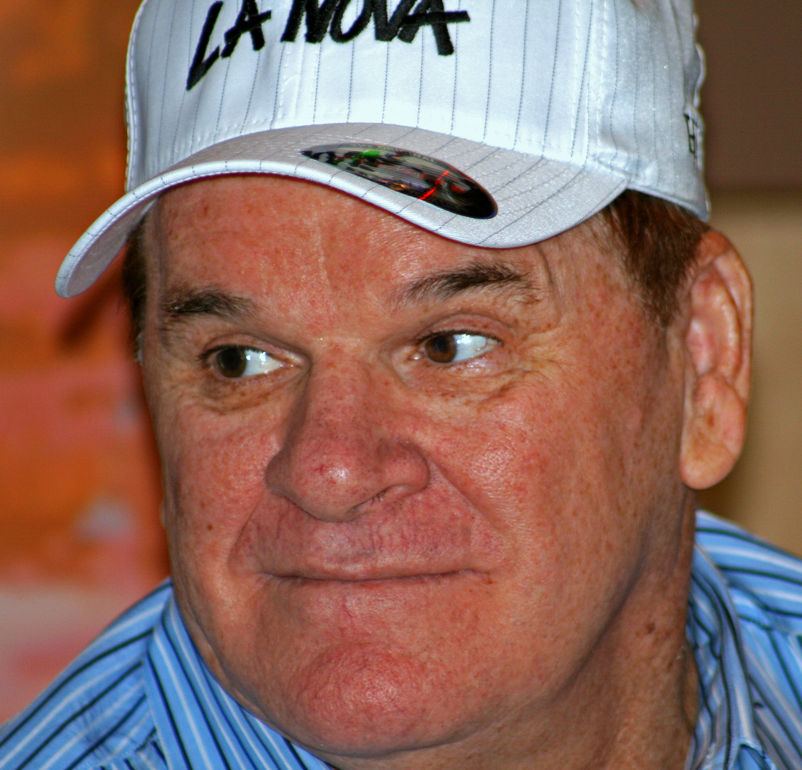 A middle-aged white male wearing a white cap.