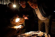 Dr Alex Ritchie, Sir David Attenborough and his son, Dr Robert Attenborough, inspect fish fossils in Canowindra, NSW, which are being stored underneath the local stadium. 22nd July 2013 Photo: Janie Barrett