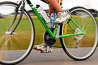 Picture supplied for M Magazine - The Sunday Age, 5 November 2006. GREAT VICTORIAN BIKE RIDE. Generic. Picture shows : close-up of a person riding a green bicycle on a bike path with a drink bottle attached.