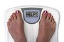 SHD SUPPLEMENTS.
Feet on a bathroom scale with the word help! on the screen. Isolated.  Includes clipping path. 

OBESITY. 

