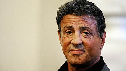 US actor and film director Sylvester Stallone speaks gives a press conference during the opening of the art exhibition 