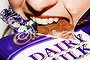 Generic pic of a woman eating chocolate, Cadbury's Dairy Milk chocolate.