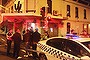 Police investigate the scene of a possible dry-by shooting at Woodstock pizzeria in North Fitzroy.