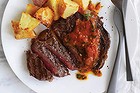 Neil Perry's aged rib-eye steak with tomato, onion and chipotle salsa.