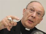 In this April 23, 2010, file photo, Belgium's Archbishop Andre-Joseph Leonard addresses the media in Brussels.