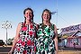 Owner of the Pink Roadhouse Oodnadatta, Lynnie Plate (left) with her twin sister Annie Trevillian and Lynnie's dog Minnie Mack.