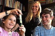 Lindy Hadges with two of her five children, Ruben, 15, and Odette, 8, whom she home schools in Carlton, Sydney.