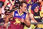 Past glory: Ex-star Daniel Bradshaw delights his home crowd at the Gabba in 2002. 