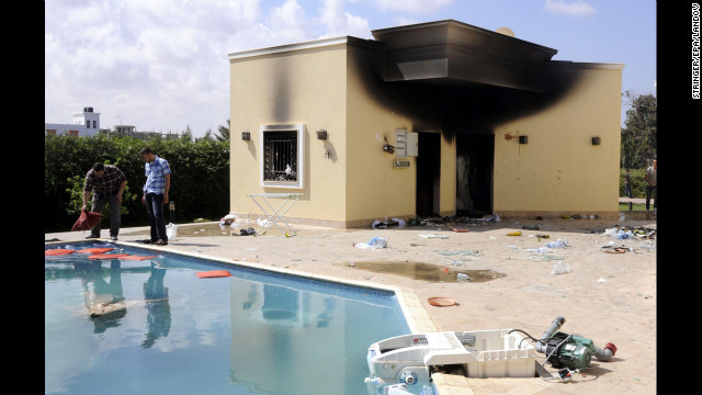 People inspect the damage at the U.S. Consulate in Benghazi, Libya, on September 12.