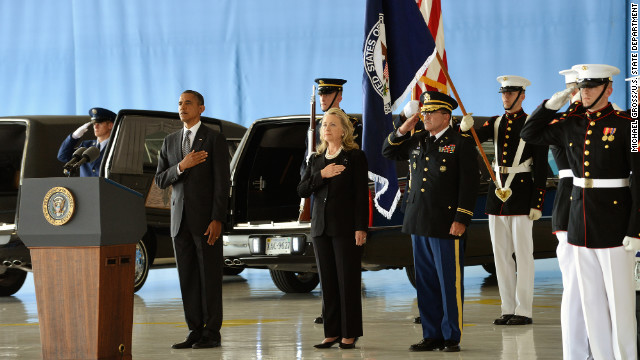 President Barack Obama and Secretary of State Hillary Clinton stand at Andrews Air Force Base as the bodies of the four Americans killed at the U.S. Consulate in Benghazi are returned on September 14.