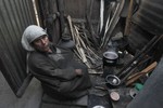 File - A shortage of LPG Gas has forced villagers to use old methods of cooking food in Bandipora district, North Kashmir, 75 km from Srinagar, 6 November, 2012.