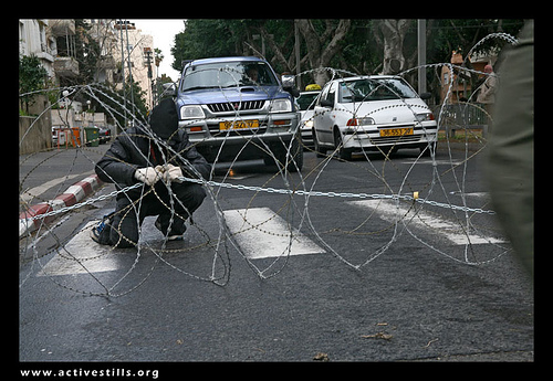 Direct Action against the wall and restrictions of movements in Palestine, Anarchists Blocking Rotchield street in Tel Aviv, Israel, 03/02/07