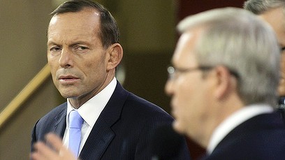 Opposition leader Tony Abbott (L) listens to Australian Prime Minister Kevin Rudd during the People's Forum in Sydney August 28, 2013. Australia will hold a federal election on September 7. REUTERS/Lukas Coch/Pool (AUSTRALIA - Tags: POLITICS ELECTIONS)