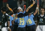 India's Sandeep Singh, center, celebrates scoring the winning goal with teammates in the men's field hockey Champions Trophy match between India and Pakistan in Madras, Sunday, Dec. 11, 2005. India scored three goals in the last nine minutes Sunday to clinch a 3-2 victory in the men's field hockey Champions Trophy. At right is Pakistan's Dilawar Hussein. 