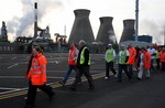 Workers leave the INEOS refinery as they start the two-day walkout by up to 1,200 workers at the site in protest at plans to close a final pension salary scheme to new workers, which has closed the Forties pipeline, which brings in 700,000 barrels of oil a day from the North Sea, in Grangemouth, Scotland, Sunday April. 27, 2008.