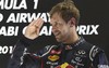 Third place Red Bull driver Sebastian Vettel of Germany celebrates on the podium after the Emirates Formula One Grand Prix, at the Yas Marina racetrack, in Abu Dhabi, United Arab Emirates