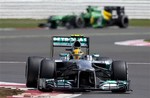 Mercedes driver Lewis Hamilton of Britain rounds Club Corner as he qualifies in pole position at the Silverstone circuit, England, Saturday, June 29, 2013.