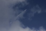 A rocket carrying the Mars orbiter streaks across the sky after taking off from the east-coast island of Sriharikota, India, Tuesday, Nov. 5, 2013.