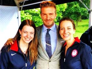 Former Olympian Sarah Hughes, right and her sister Emily, also an Olympic figure skater, show off one of the perks of being an accomplished athlete: Meeting the likes of David Beckham at the 2012 Summer Games.