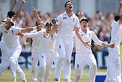 NOTTINGHAM, ENGLAND - JULY 14: James Anderson of England celebrates the final wicket of Brad Haddin of Australia and victory with team mates during day five of the 1st Investec Ashes Test match between England and Australia at Trent Bridge Cricket Ground on July 14, 2013 in Nottingham, England. (Photo by Gareth Copley/Getty Images)