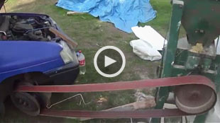 Image: Video still of car-powered grain grinder (Courtesy of Stupid Videos)