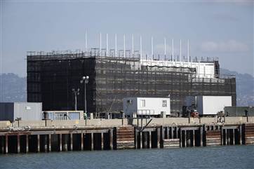 A barge built with four levels of shipping containers is seen at Pier 1 at Treasure Island in San Francisco.Plans call for it to become an "unprecedented artistic structure" that will move around the bay by tugboat.