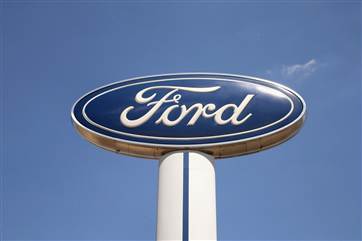 A Ford logo stands above the Al Piemonte Ford dealership on June 3, 2013 in Melrose Park, Illinois.