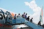 Passengers disembark Jetstar's first commercial Dreamliner flight after landing on the Gold Coast.