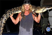 Innisfail fisherman Ashley Sala hooks a crocodile at Innisfail and takes it to his caravan park for the night