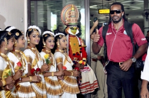 West Indies player Chris Gayle being welcomed on his arrival at the airport in Kochi on Tuesday...